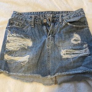 Distressed denim mini skirt